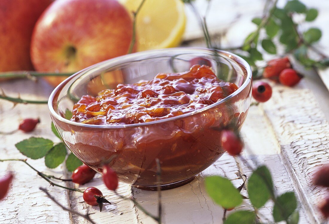 Rosehip and apple preserve in glass bowl