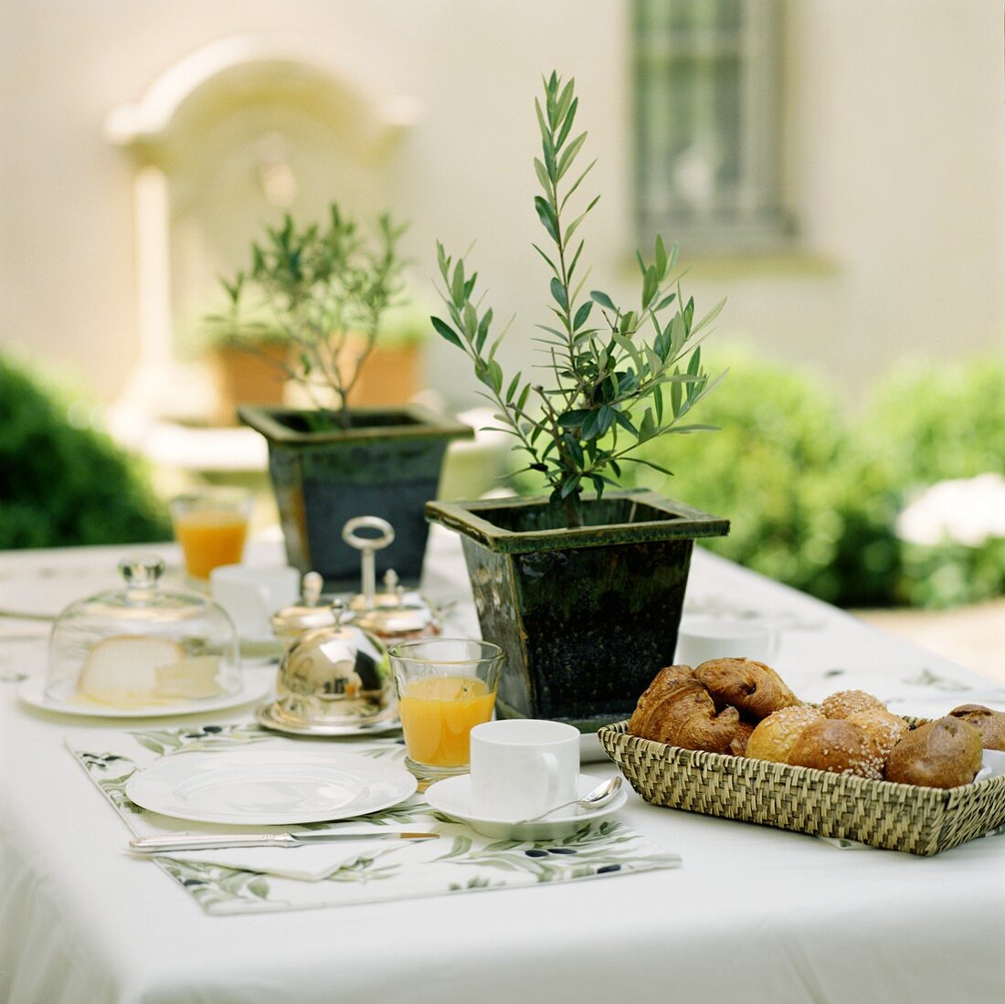 Mediterranean breakfast with croissants in open air