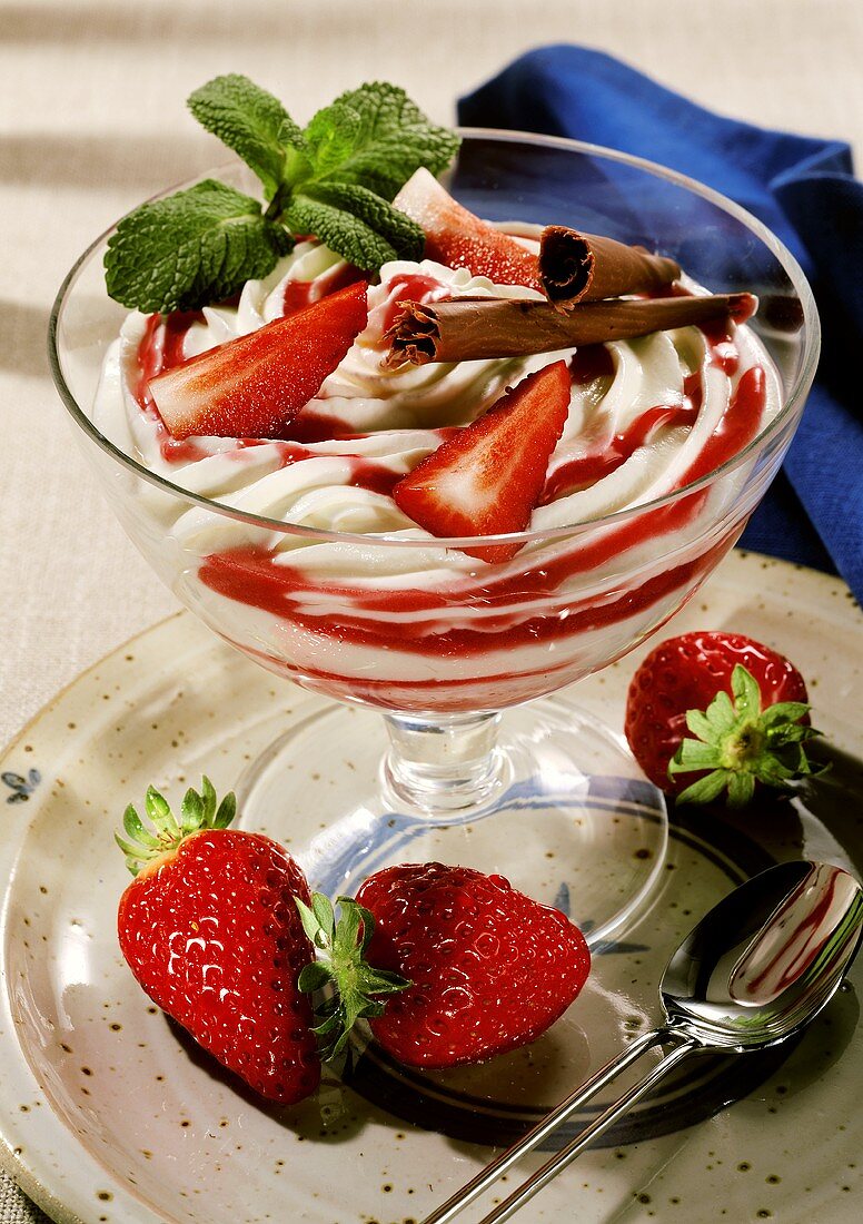 Marbled strawberry quark with chocolate fan in dessert glass