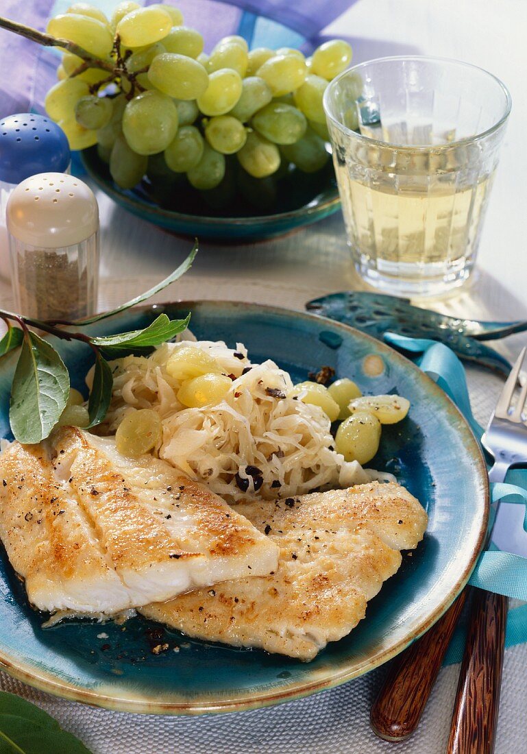 Pike-perch fillet on creamed cabbage with green grapes