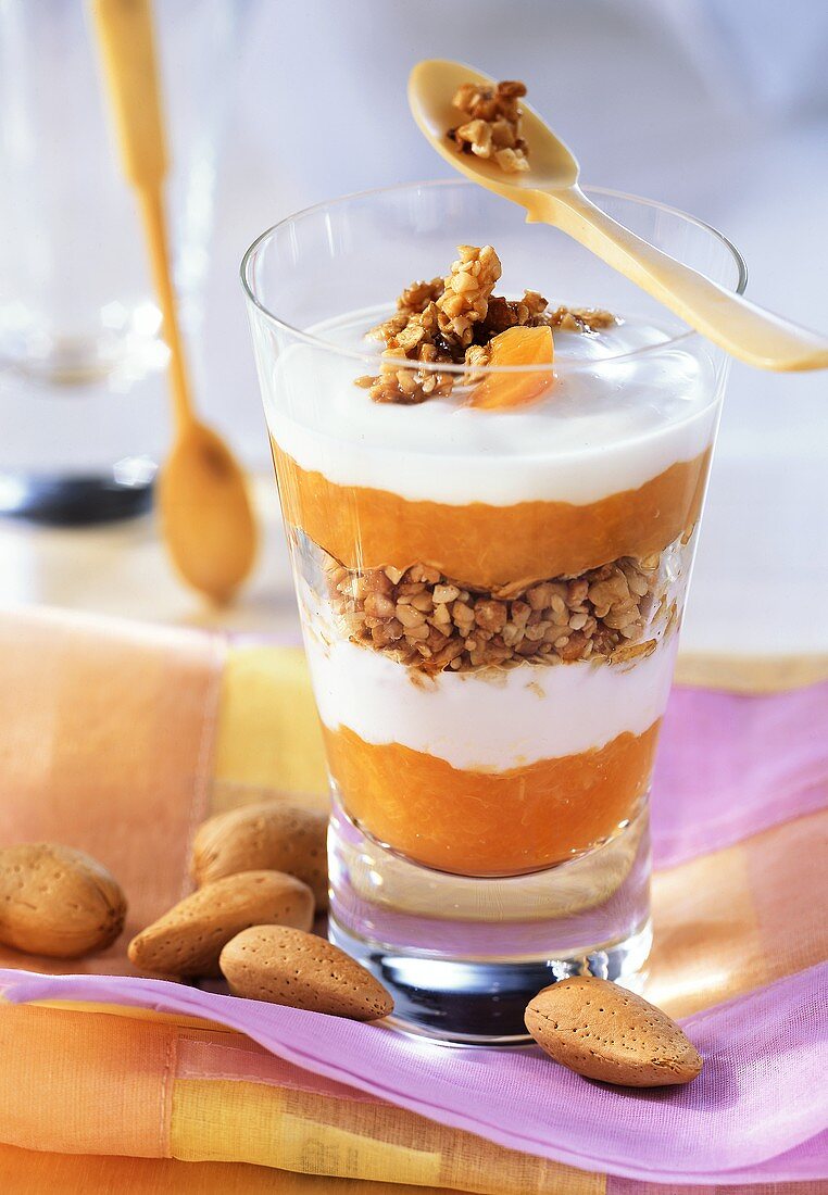 Yoghurt with cornflakes and apricot compote in jar