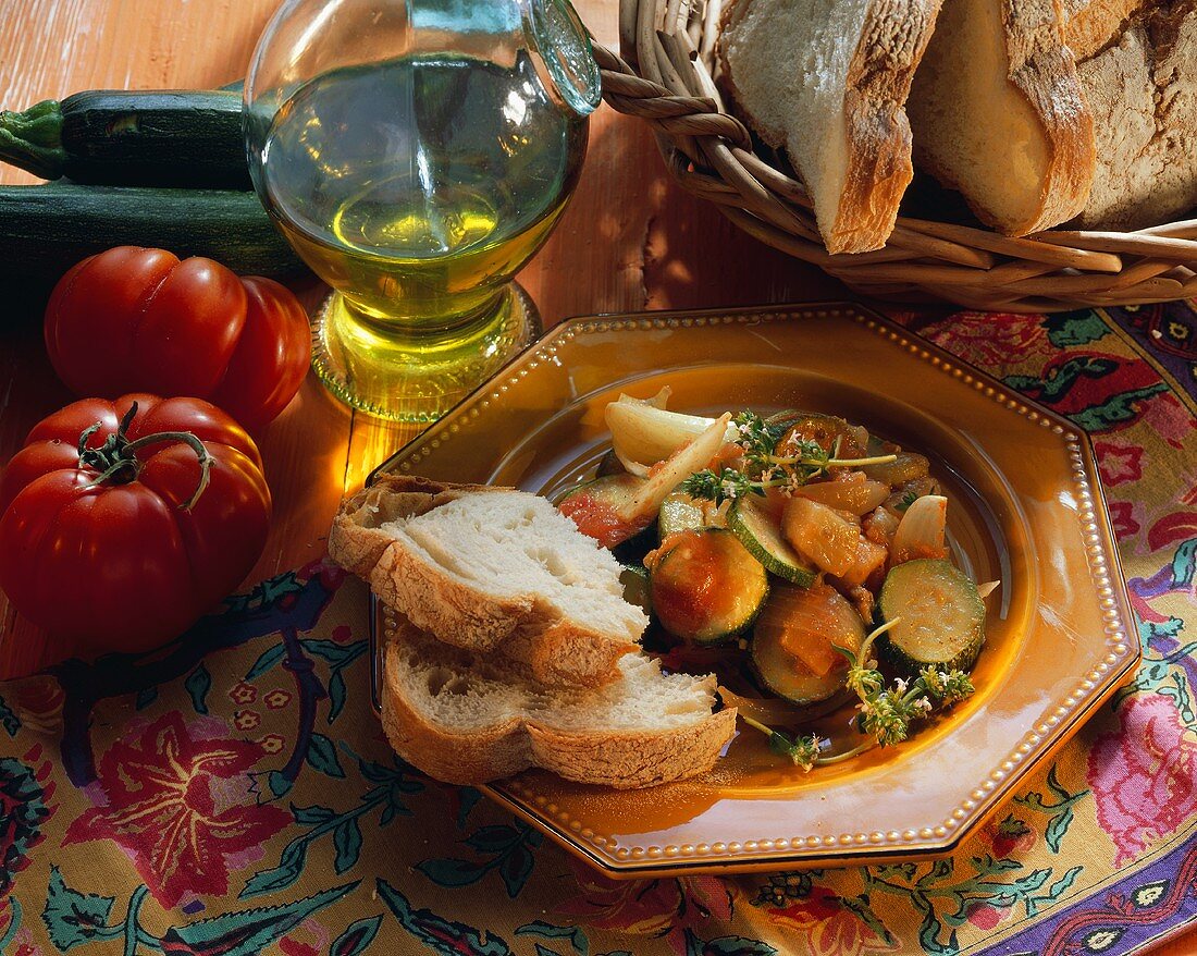 Provencal vegetables with white bread; olive oil, tomatoes