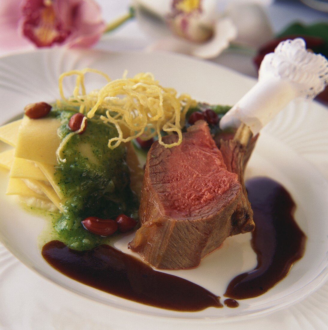Lamb with wasabi pesto and parsnips on plate