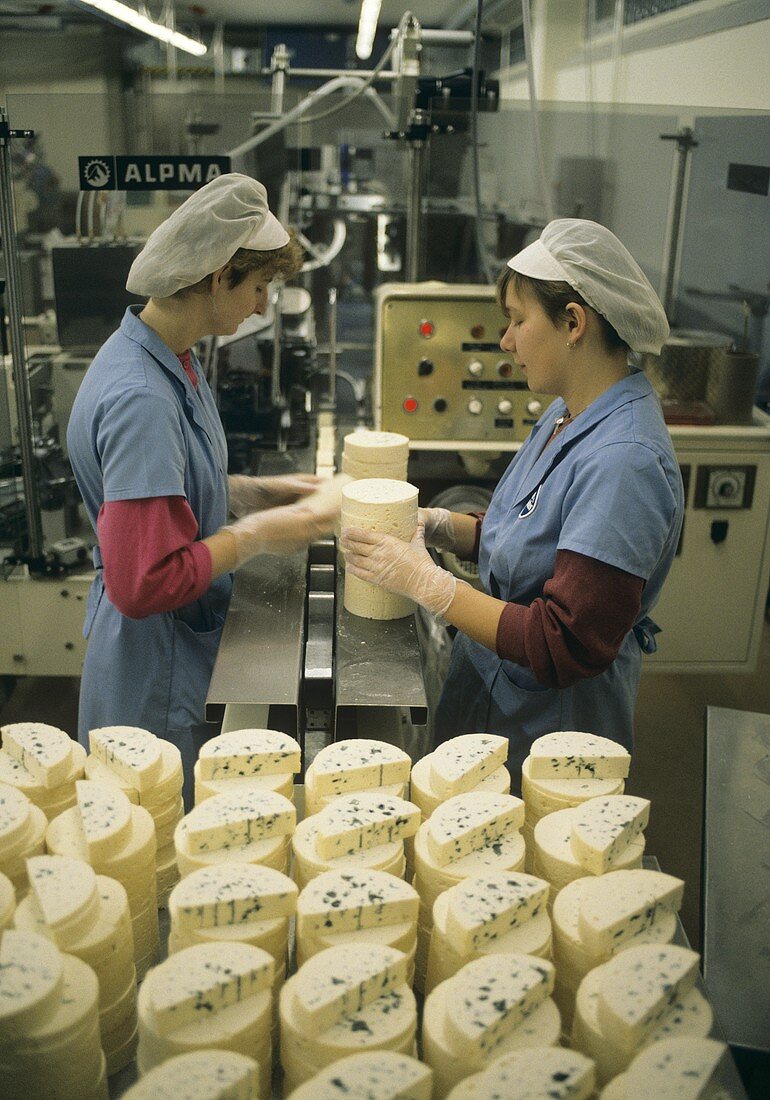 Female worker at Brie packing station