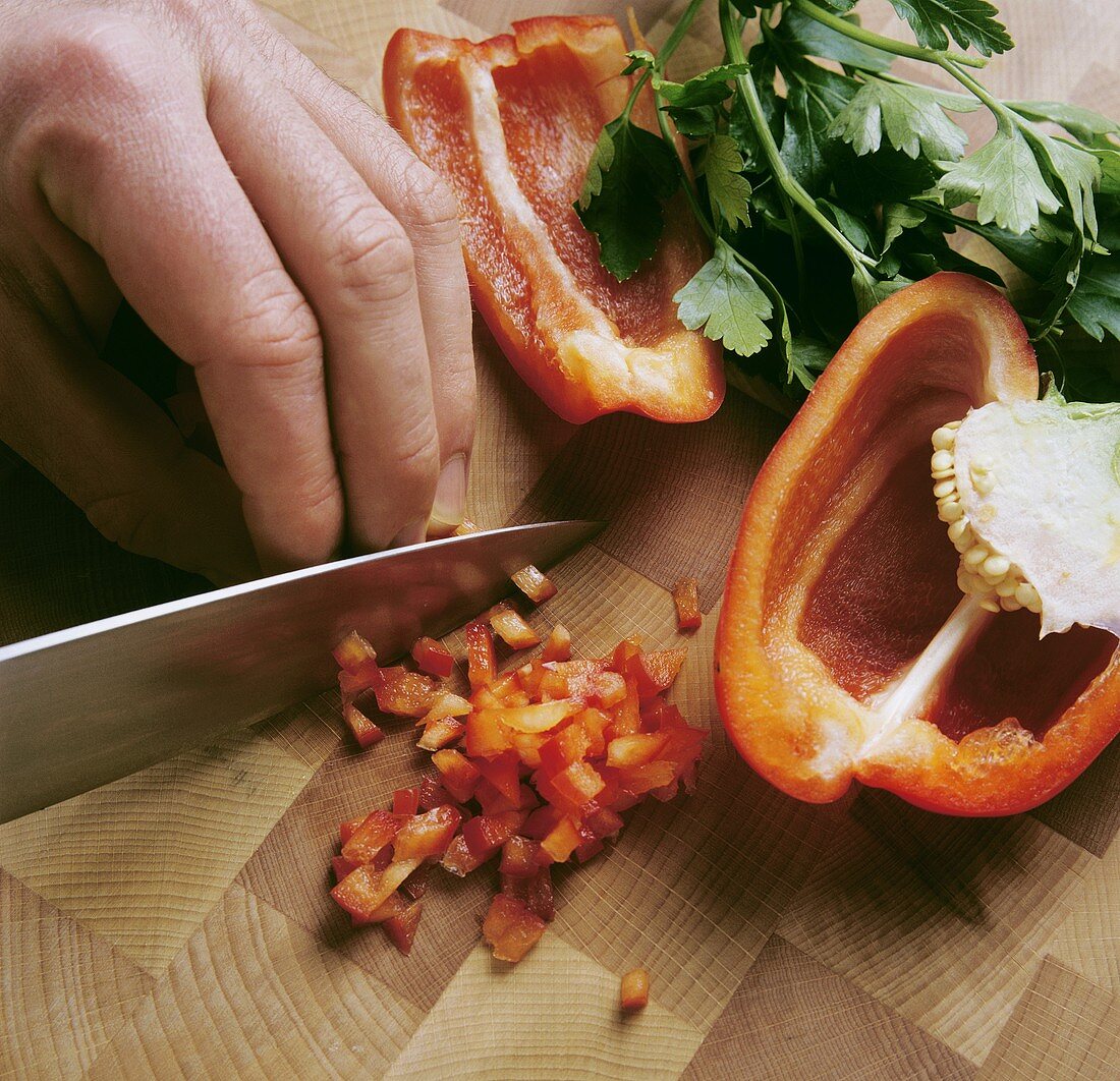 Slicing Red Peppers on a Cutting Board