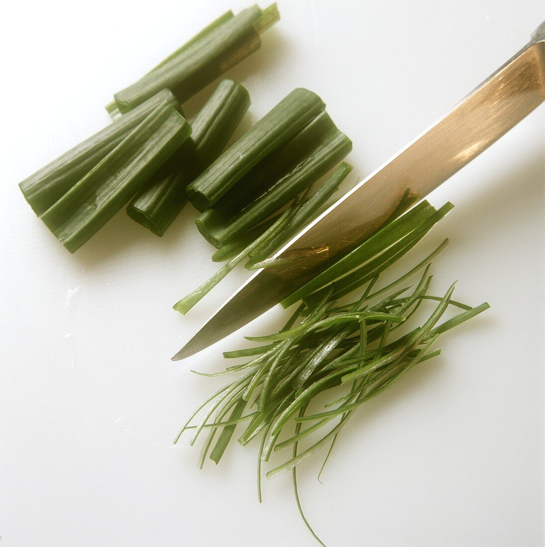 Cutting spring onions into fine strips
