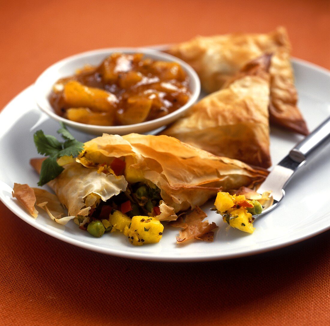 Filo pastry parcels with vegetable filling on plate