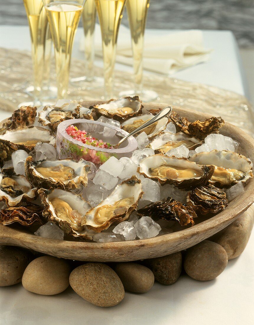 Fresh oysters on ice in an earthenware bowl