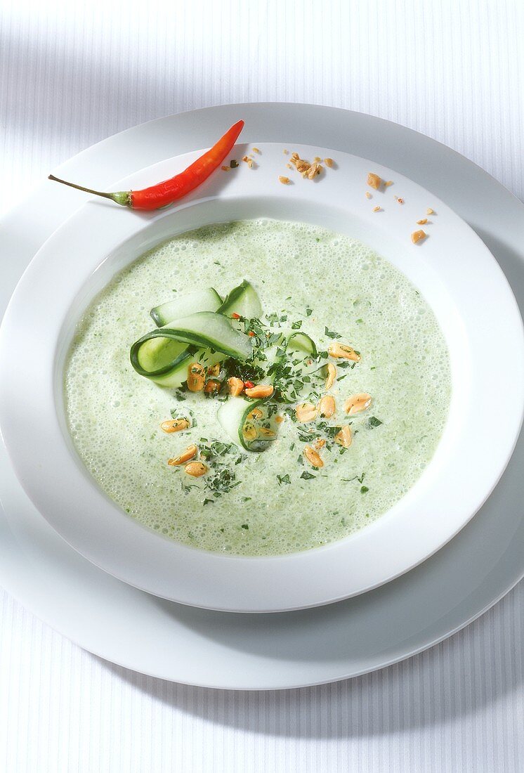 Cream of courgette soup with peanuts and chili