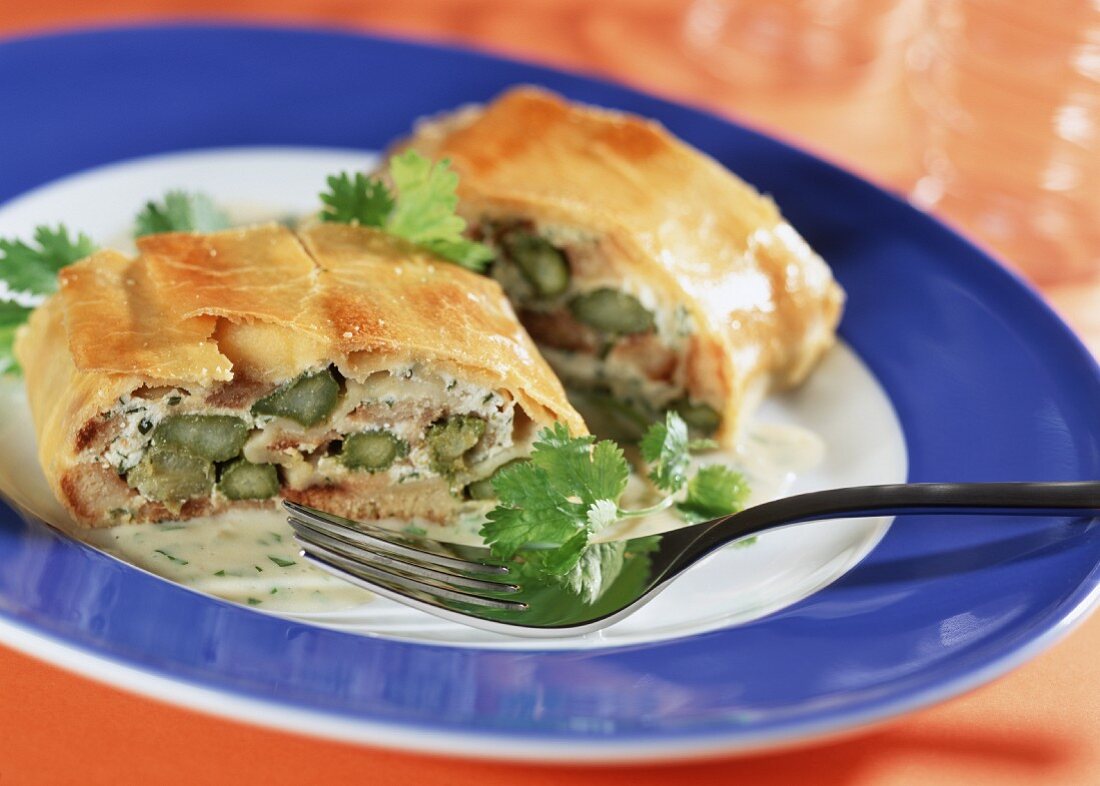 Asparagus strudel with ricotta and coriander leaves