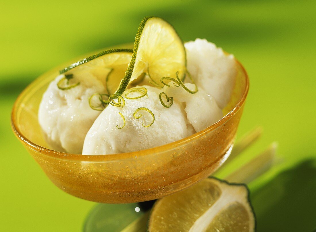 Lemon grass sorbet with lime slices and lime zest