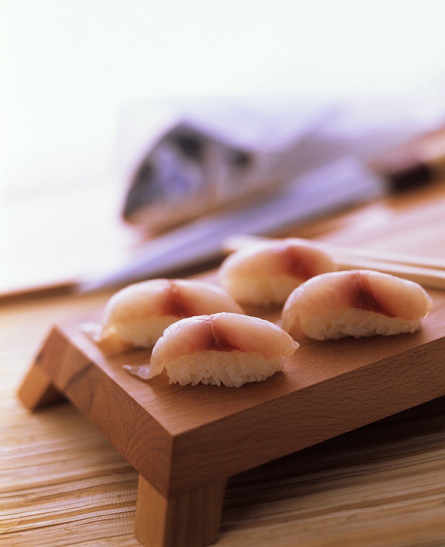 Nigiri sushi with sea bream on a sushi board