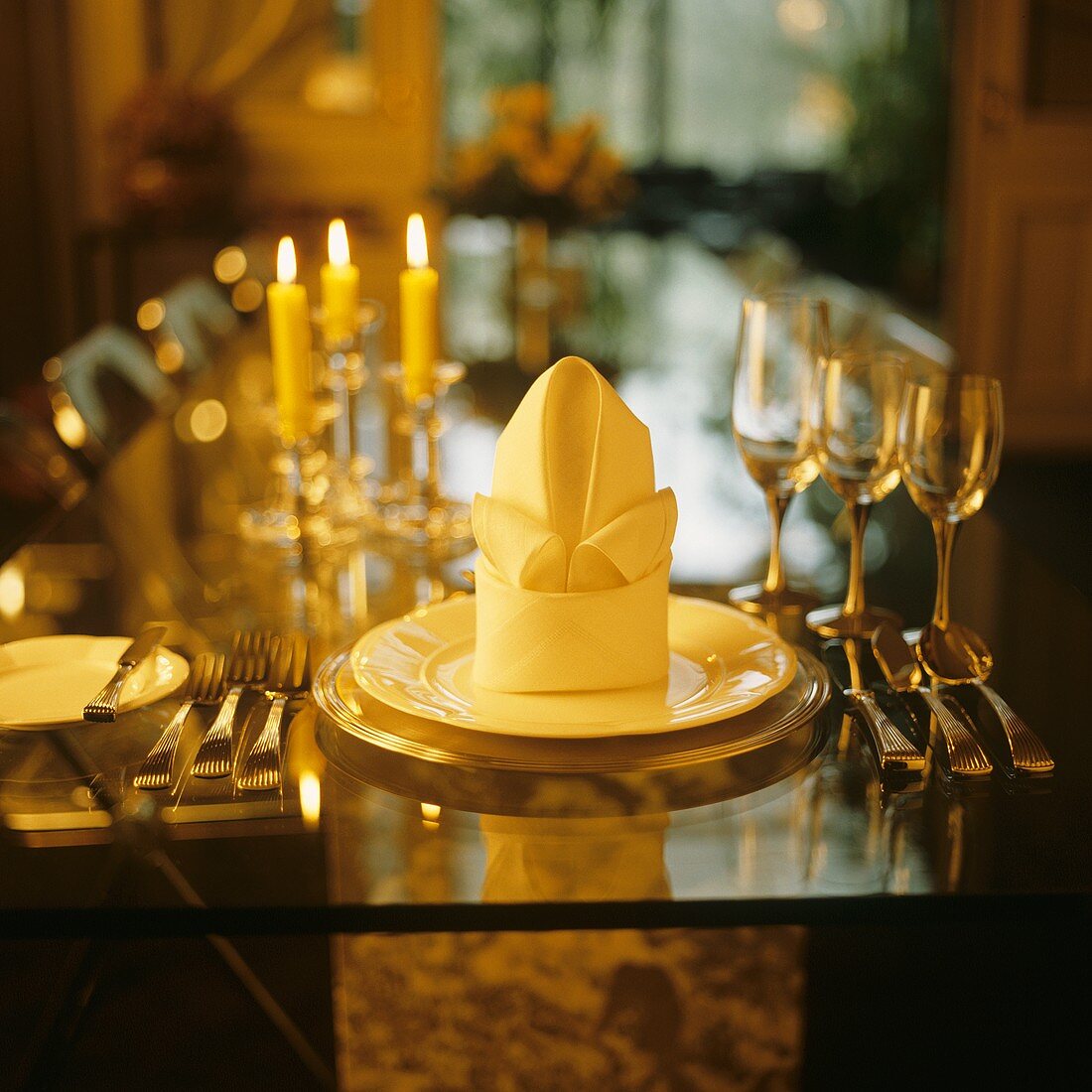Table setting with stylishly folded napkin