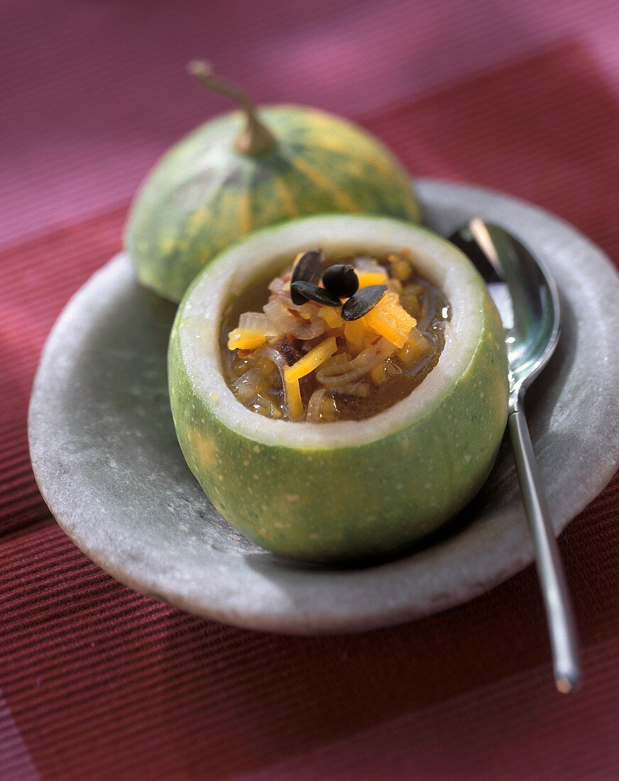 Pumpkin and orange soup in hollowed-out pumpkin