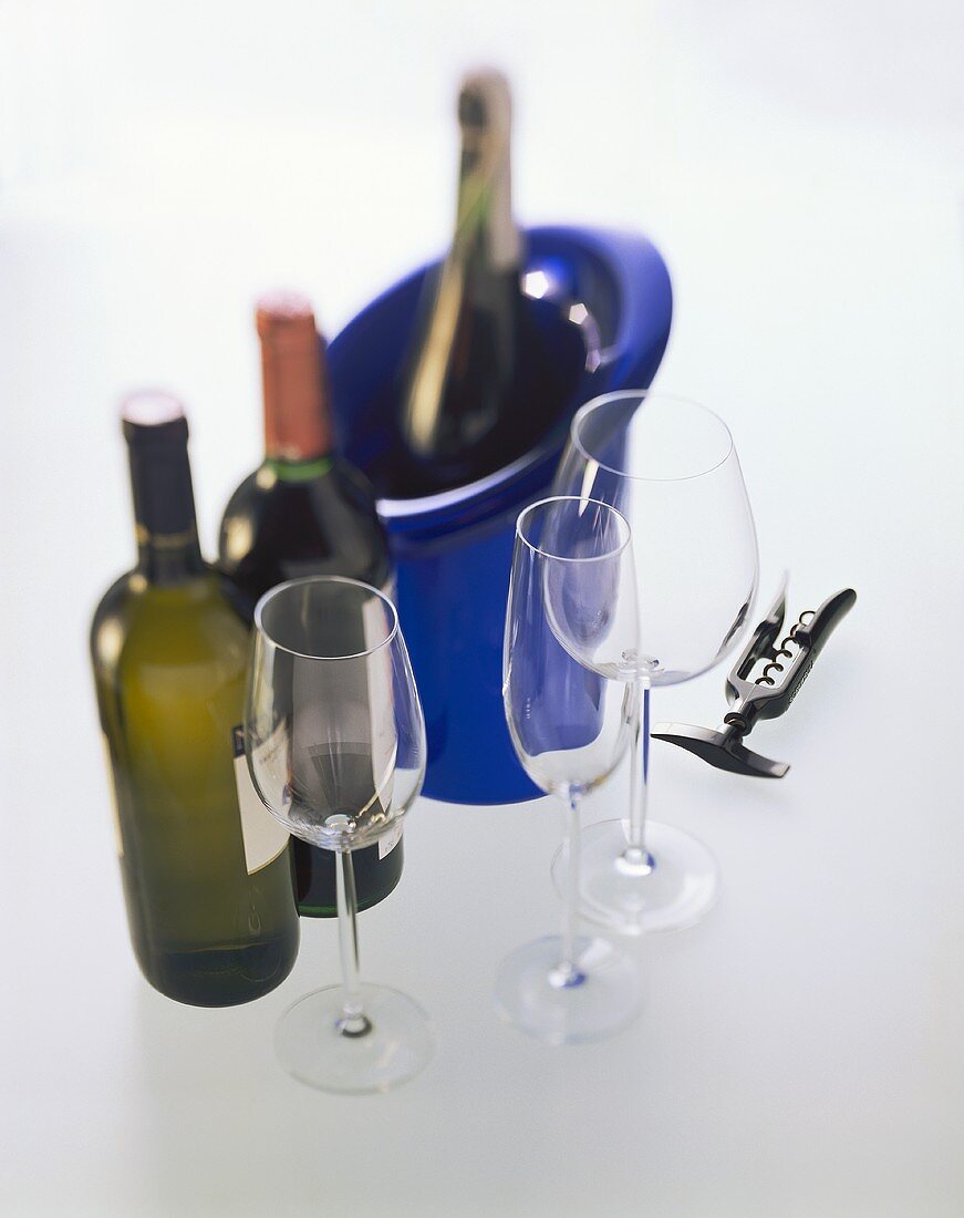 Wine glasses, champagne glass; cooler; corkscrew; wine bottles