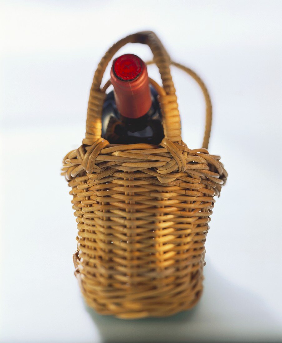 Red wine bottle in wine basket
