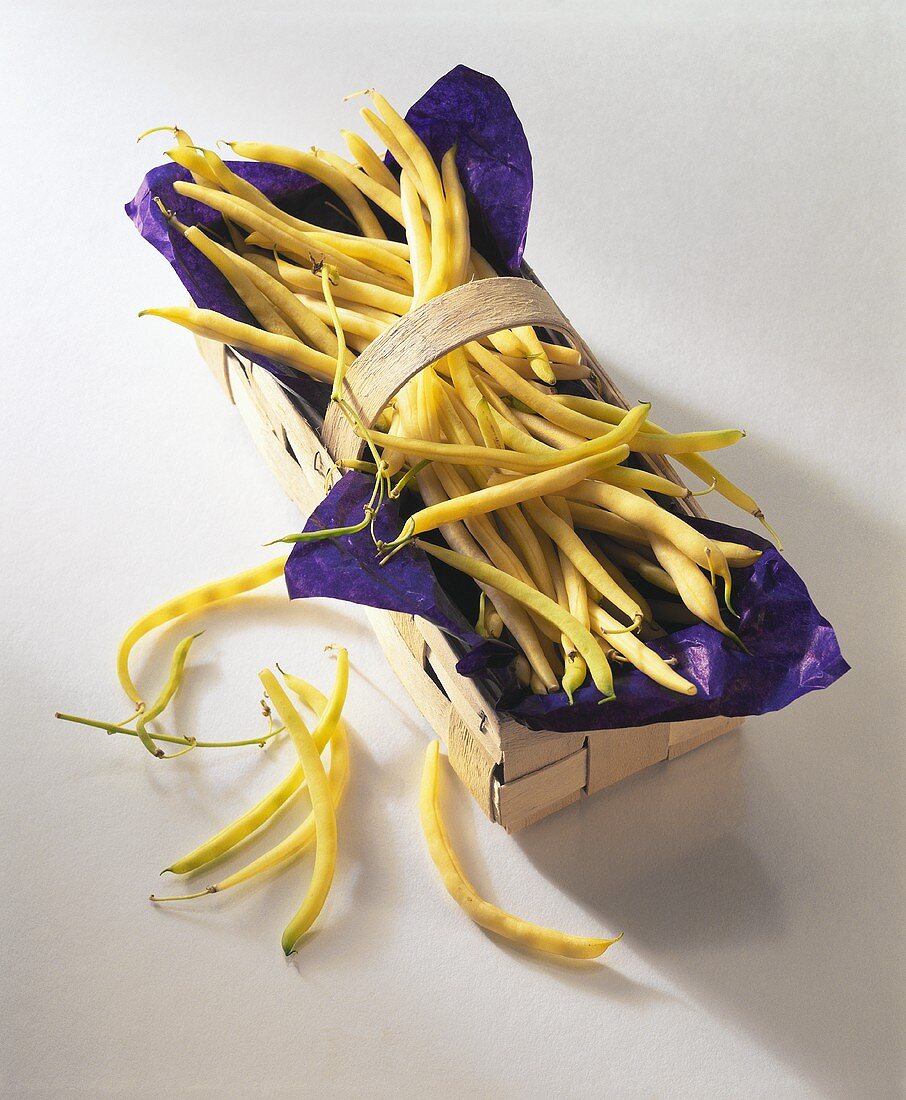 Yellow wax beans in woodchip basket