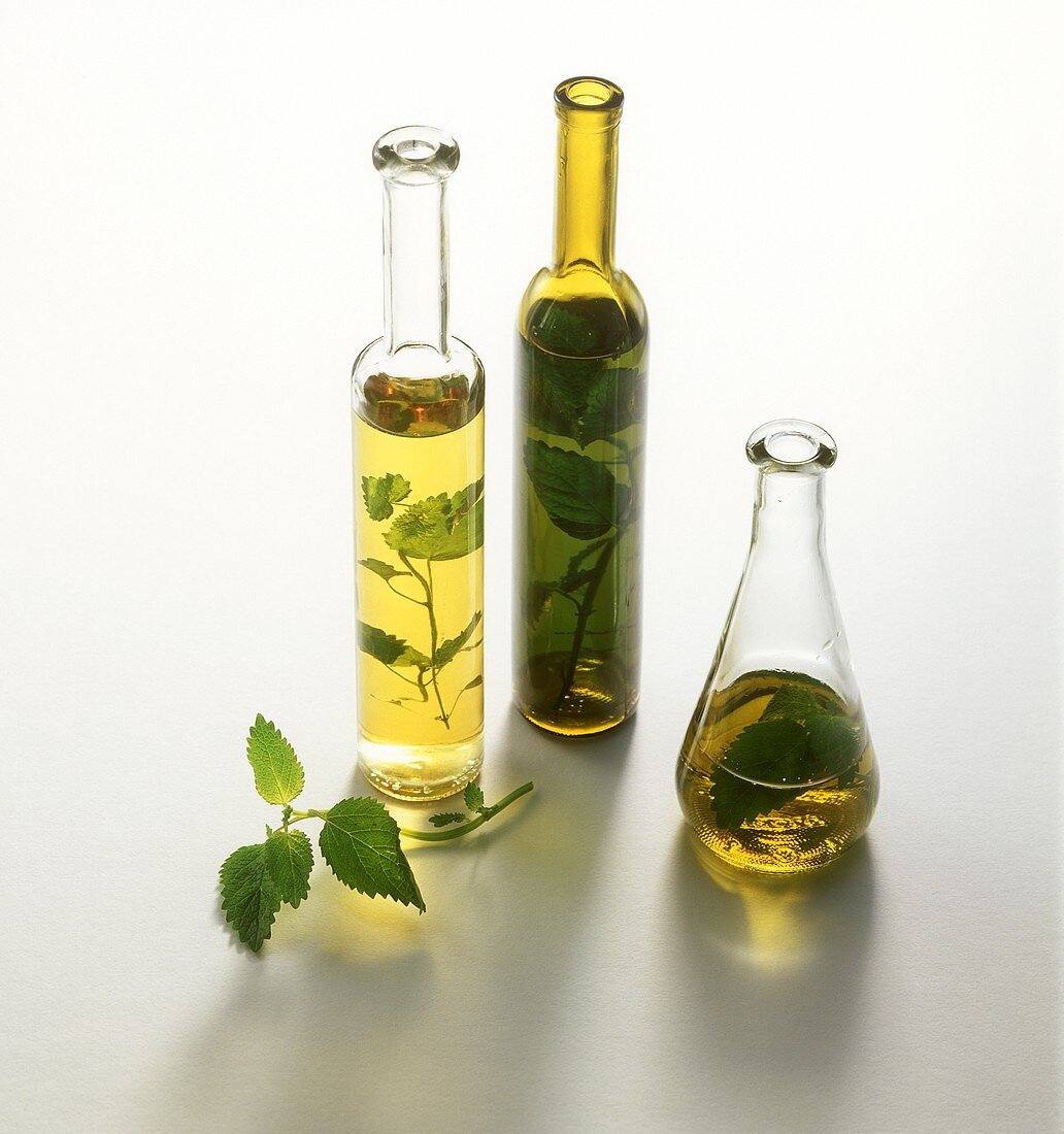 Three herb vinegars in bottles