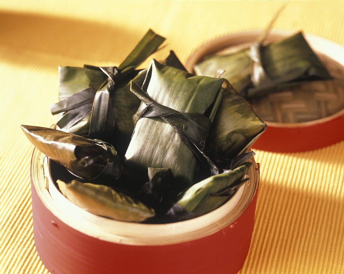 Stuffed banana leaves in bamboo steamer