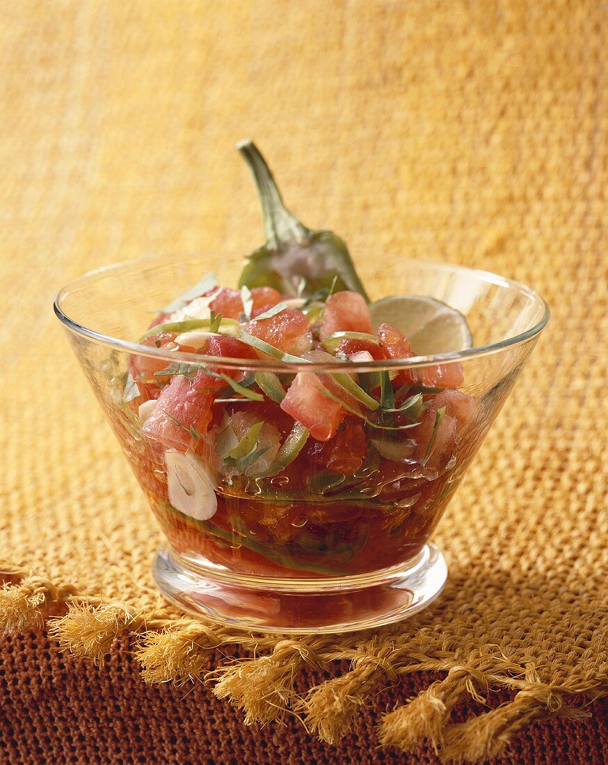 Tomato salad with pepperoni and fresh coriander