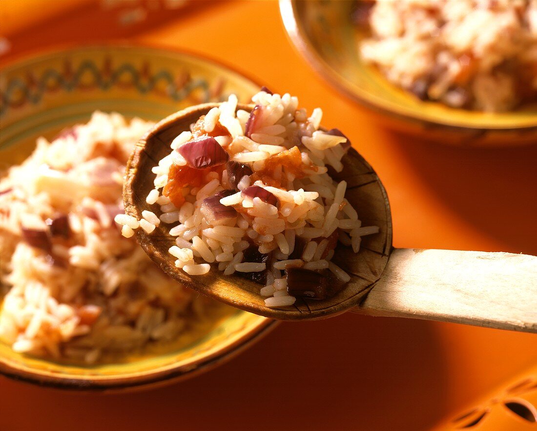 Mexican rice with red onions and tomatoes
