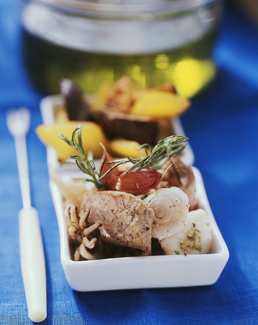 Mediterranean fish fondue with garlic, rosemary & olive oil