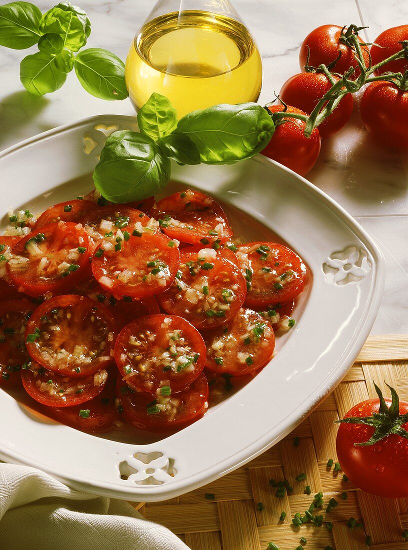 Tomato salad with chives; olive oil; basil