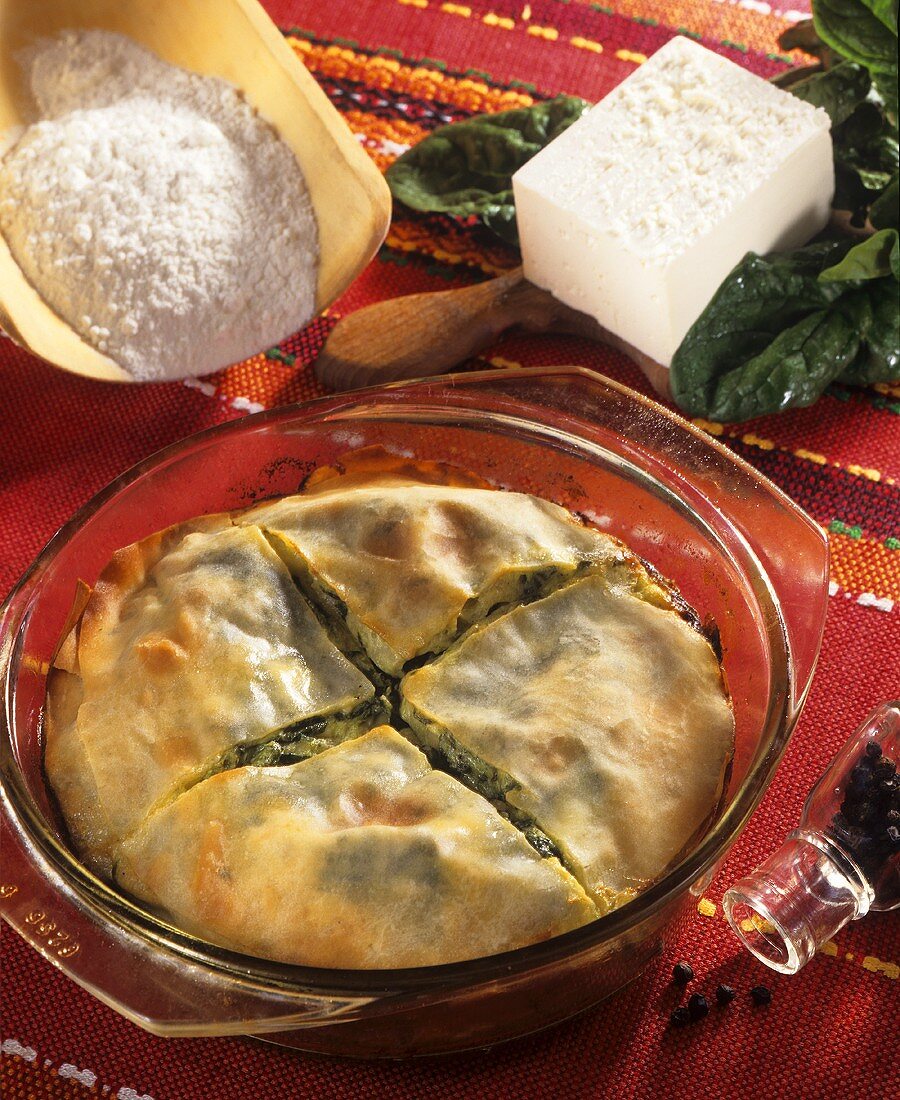 Spinach and sheep's cheese strudel in a glass dish