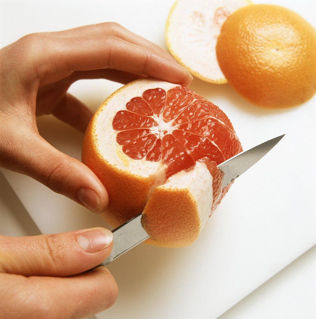 Segmenting pink grapefruit