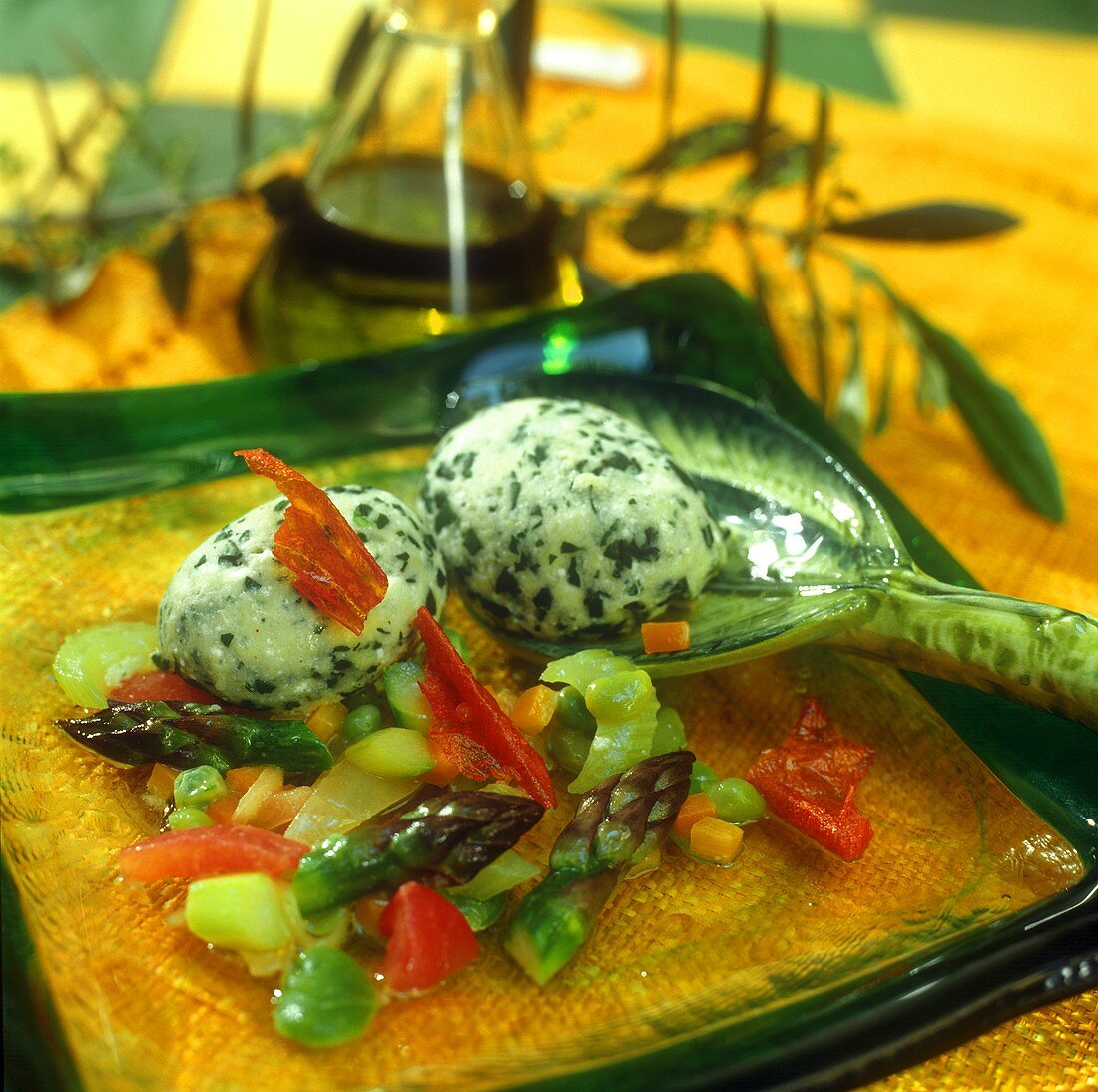 Quark and spinach dumplings on young vegetables