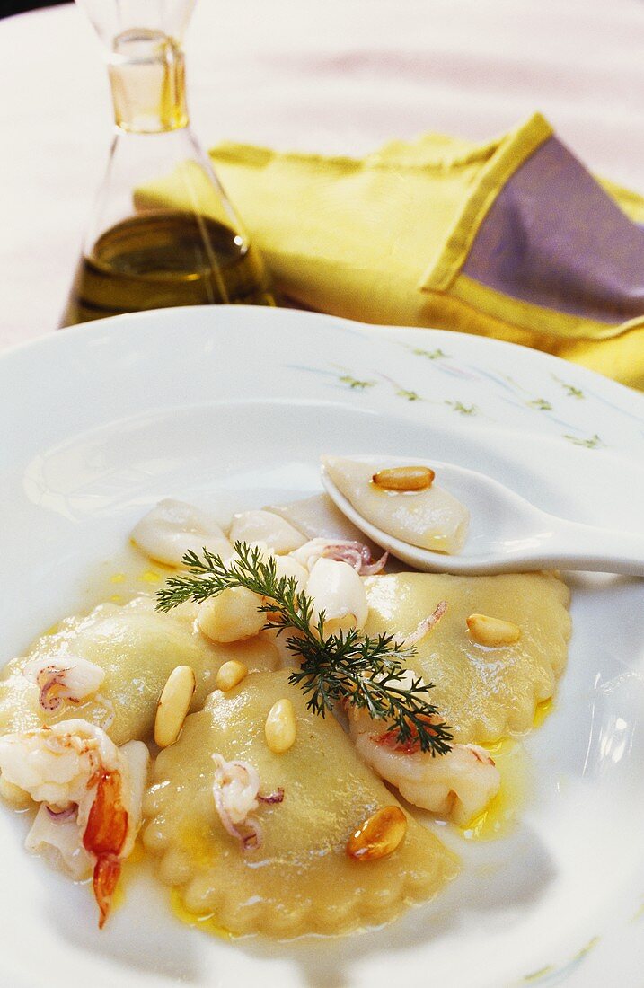 Seafood ravioli with pine nuts