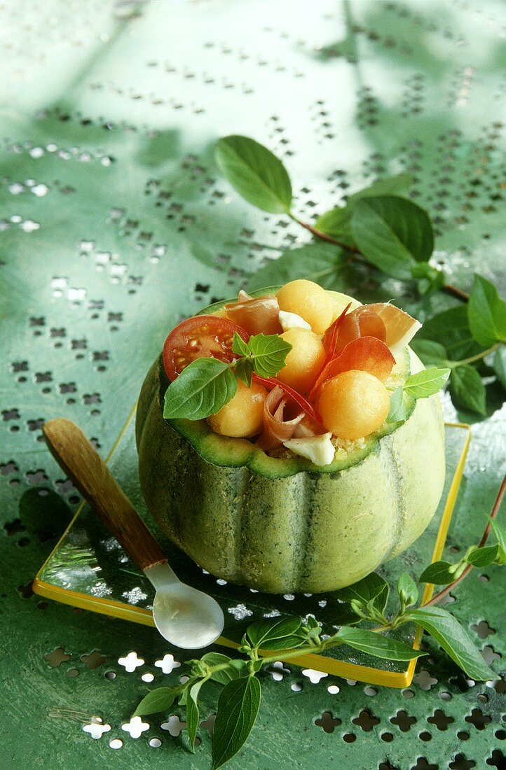 Stuffed melon with ham and tomatoes