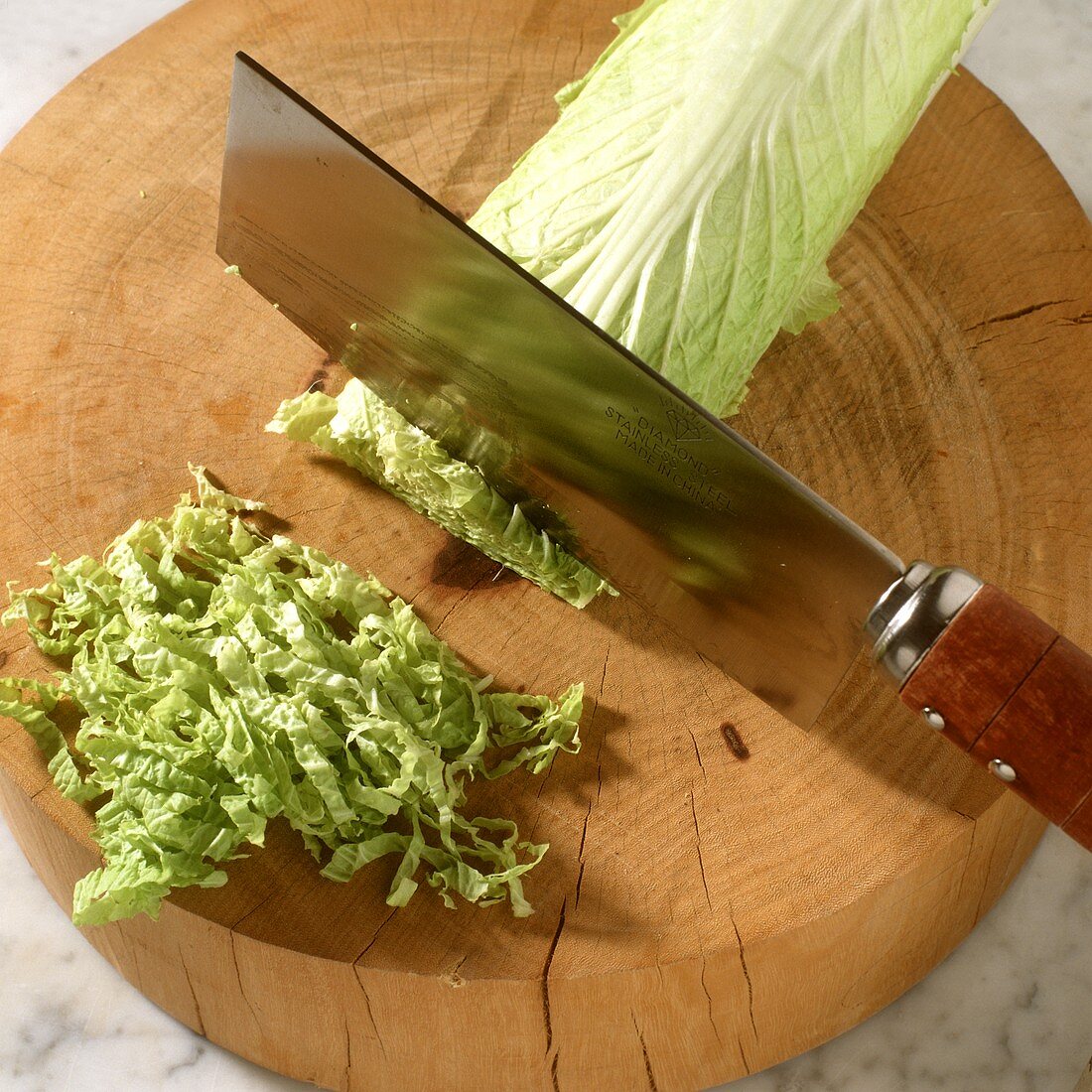 Chopping Chinese cabbage into fine strips