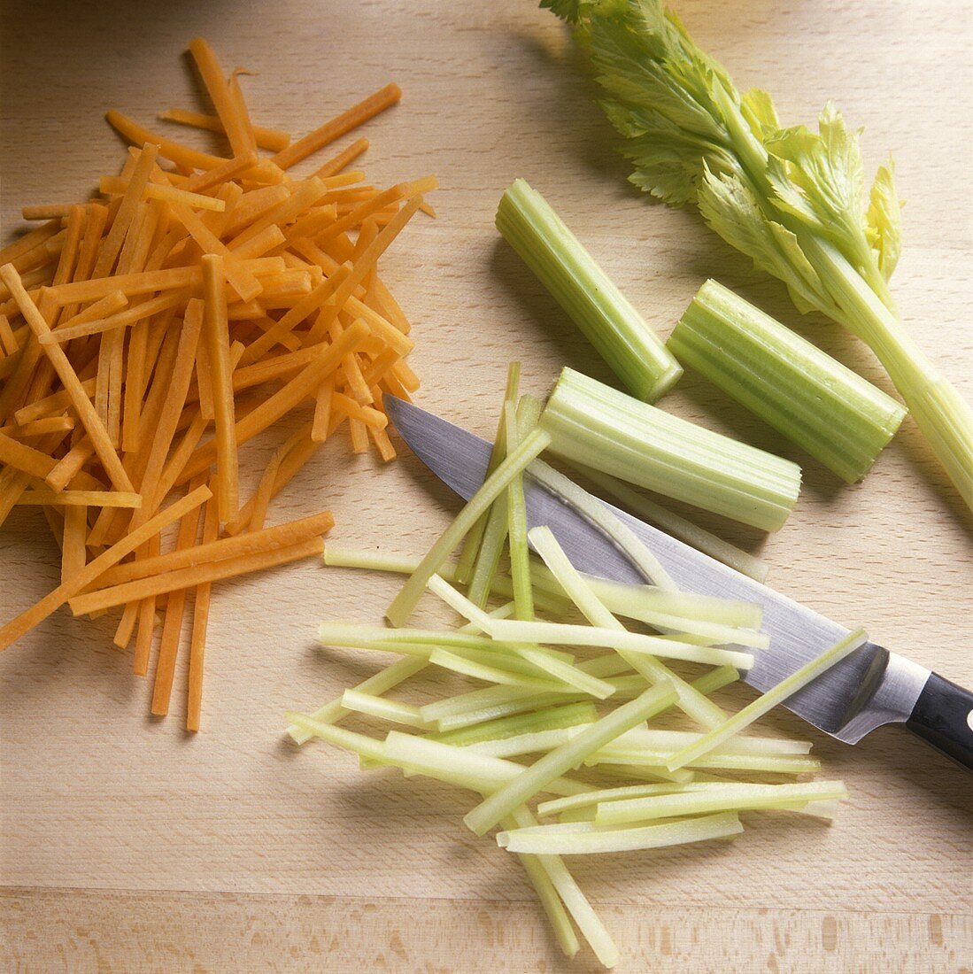 Cutting carrots and celery into strips