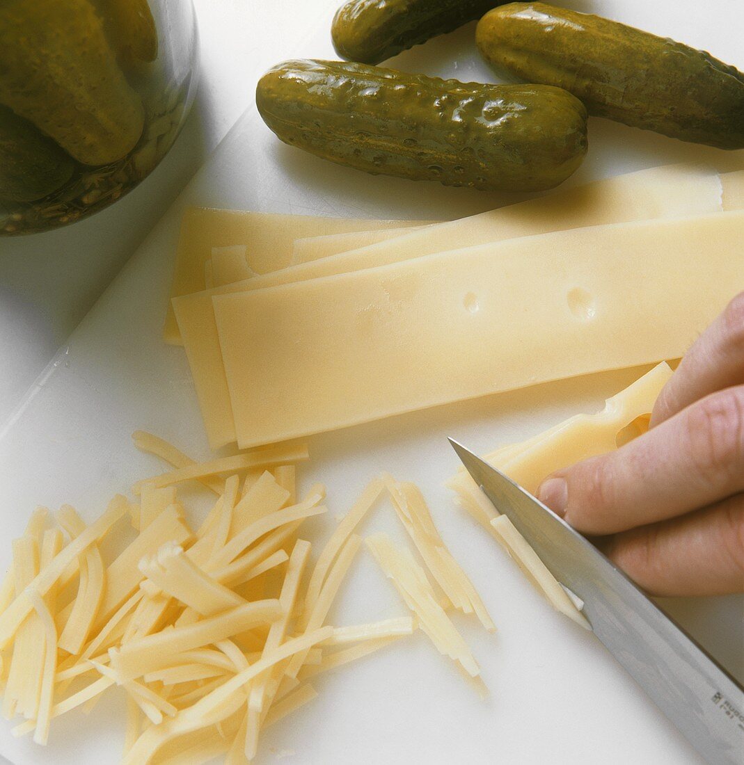 Cutting cheese into strips