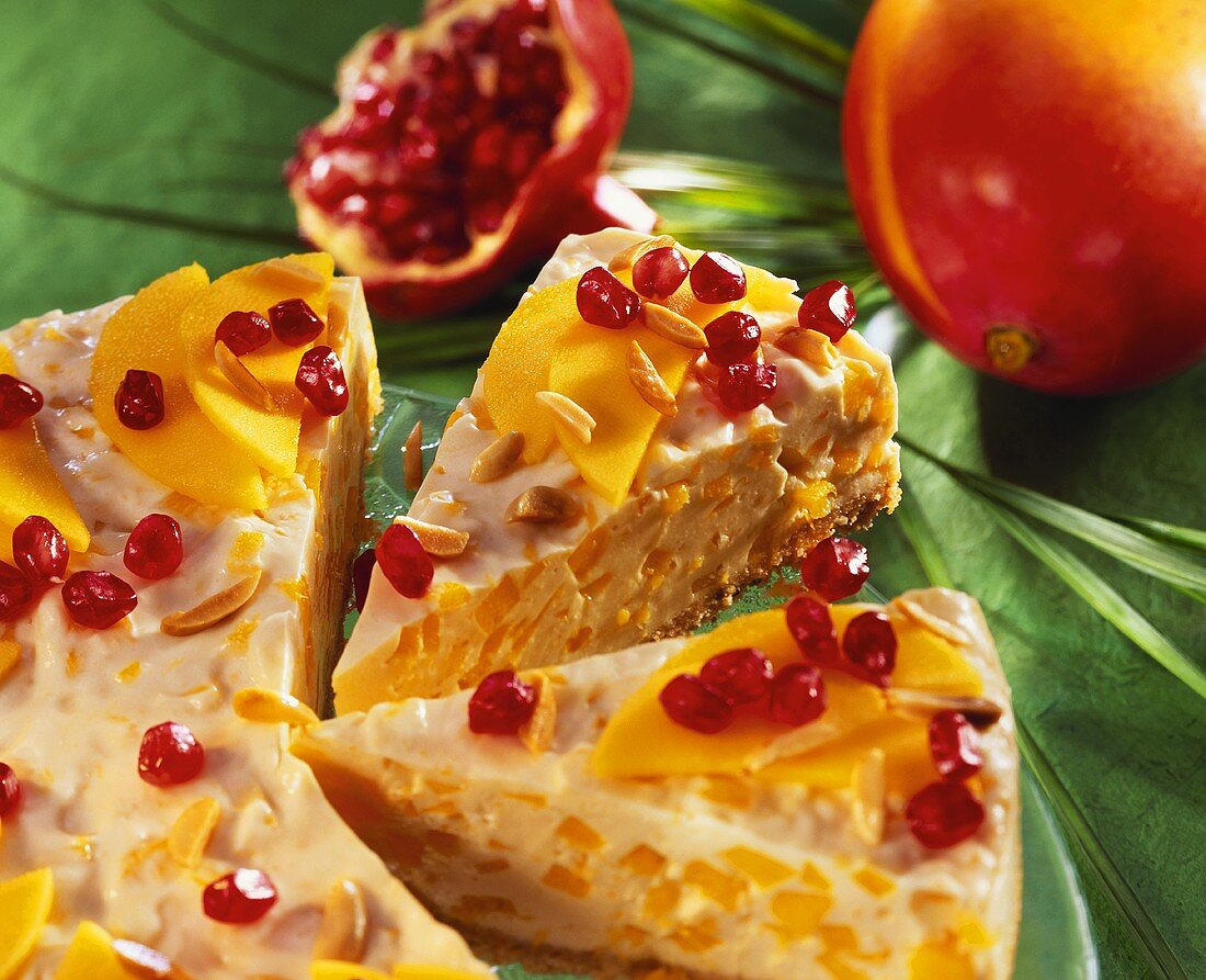 Mango gateau with almonds and pomegranate seeds