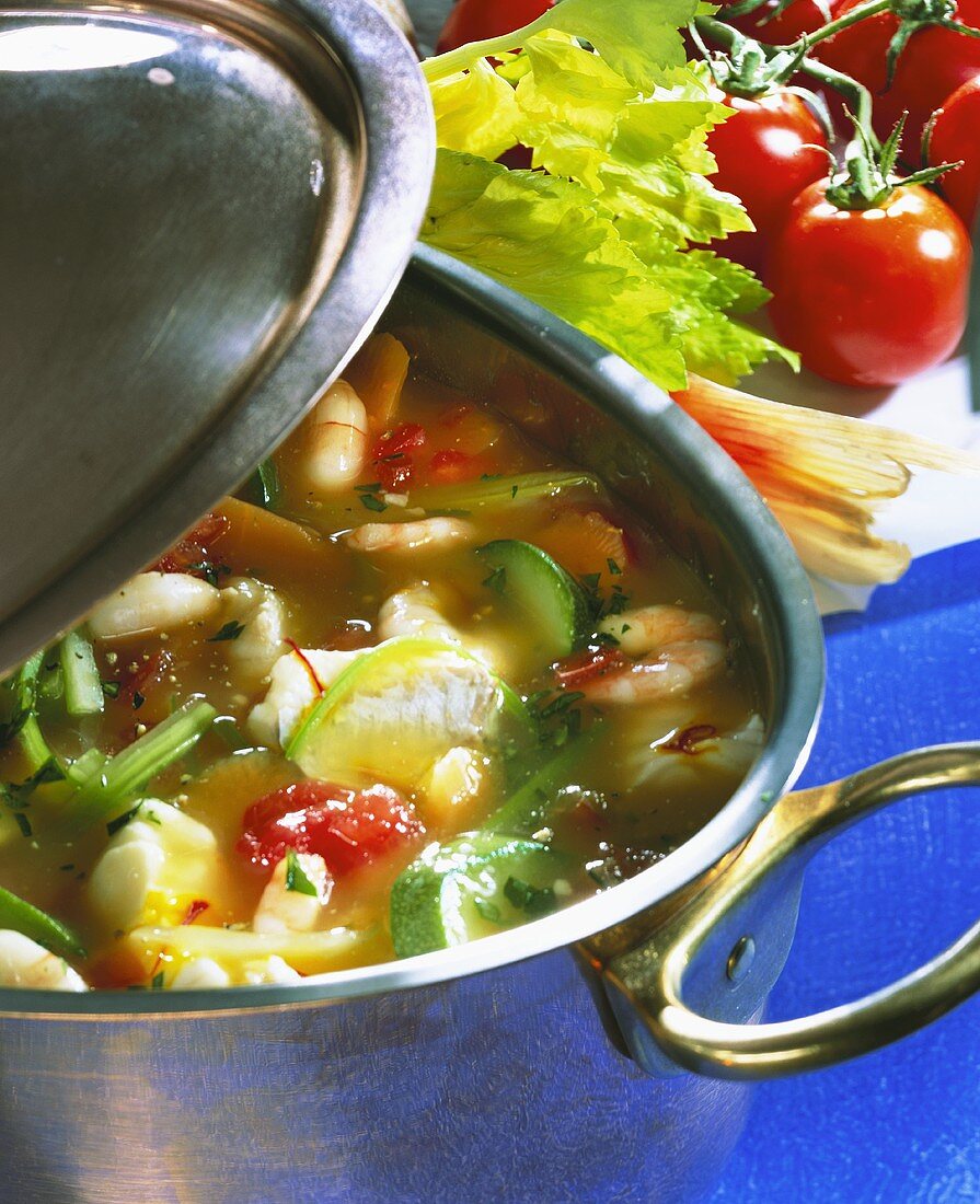 Fish soup with vegetables in soup pot