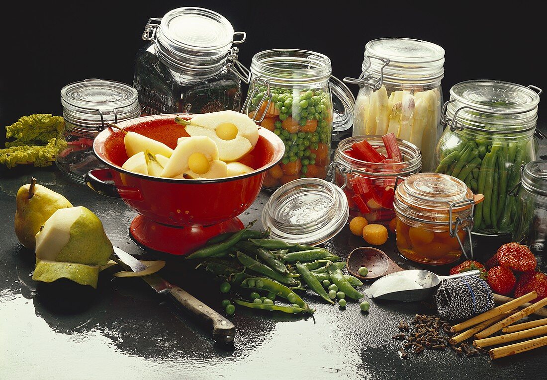 Bottled fruit and vegetables in jars; pears in sieve
