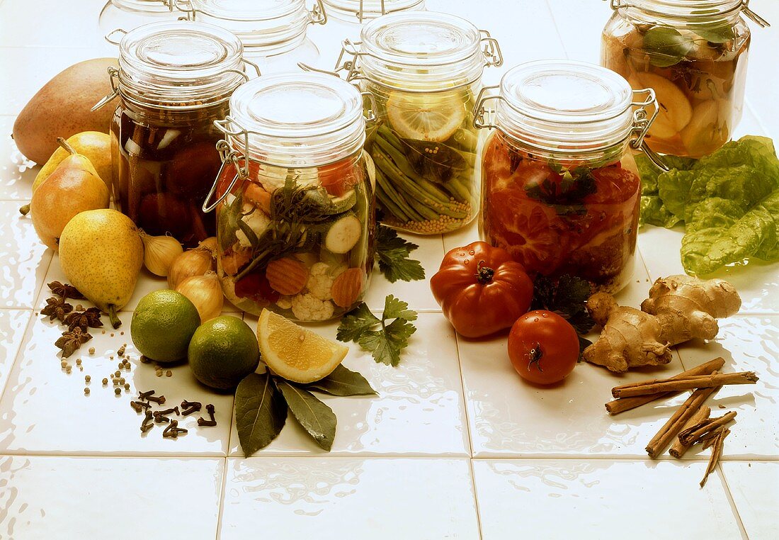 Sweet and sour preserves in jars; various ingredients