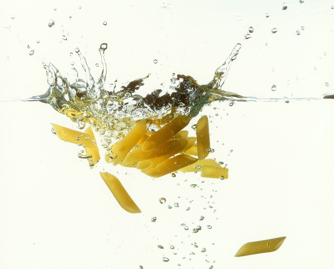 Penne falling into water
