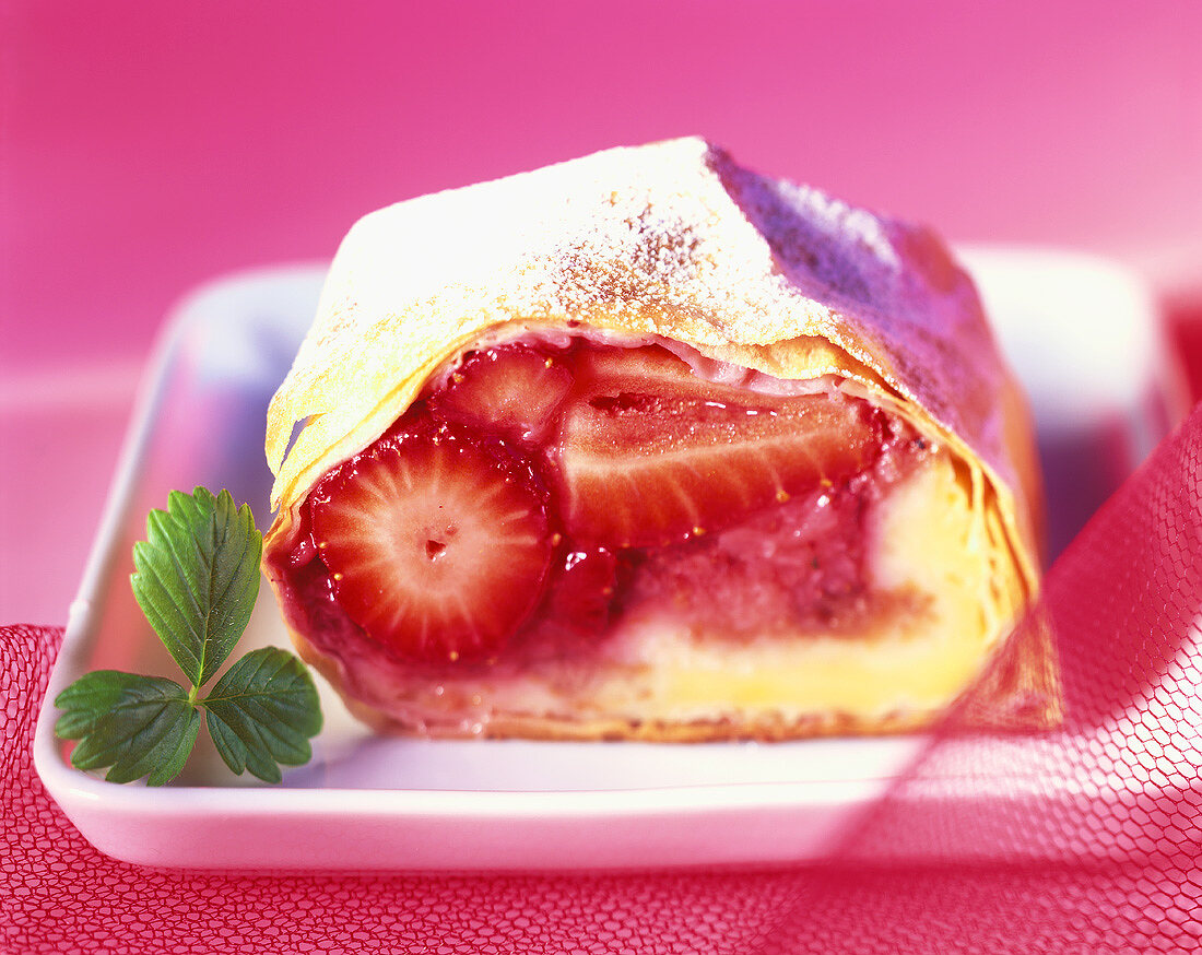 Strawberry strudel with icing sugar