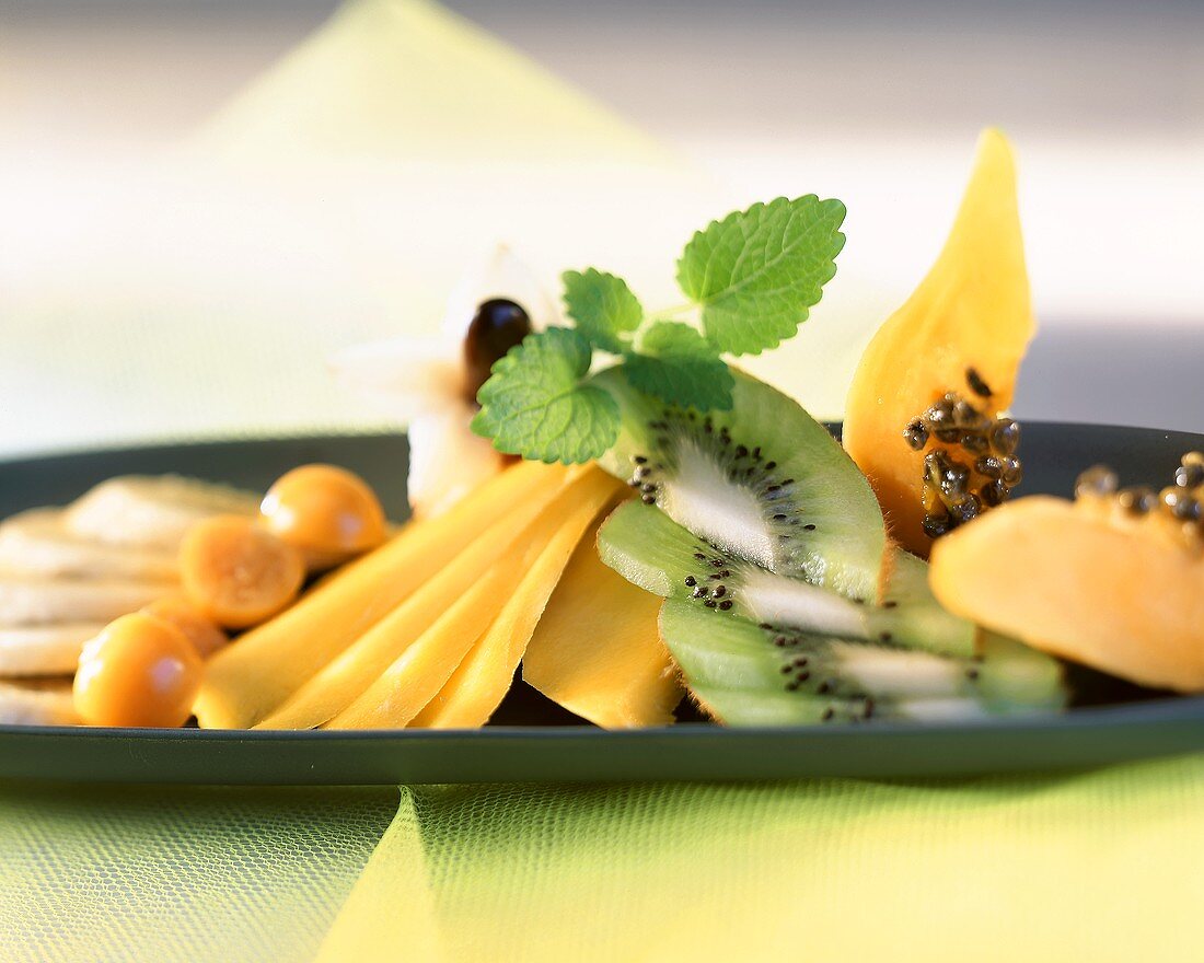 Exotic fruit salad with mint leaves