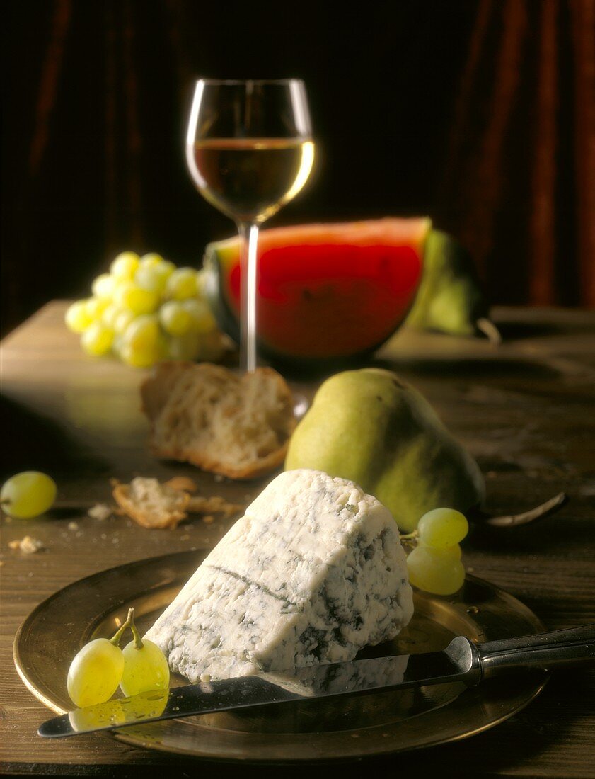 Roquefort with fruit, bread and wine glass