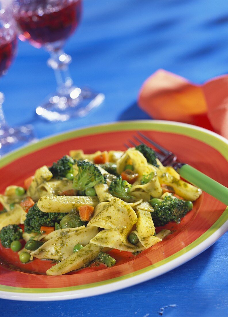 Pasta with basil sauce and vegetables
