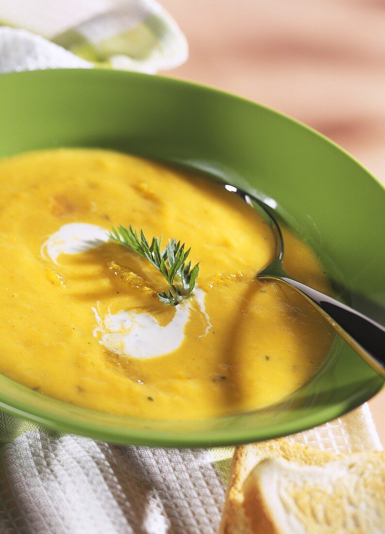 Carrot and orange soup with parsley leaf