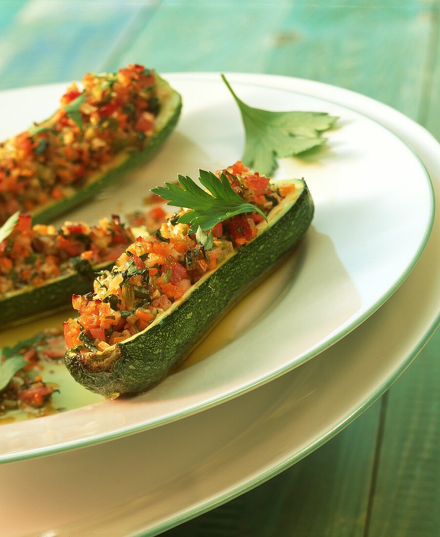 Stuffed courgettes with diced ham and vegetables