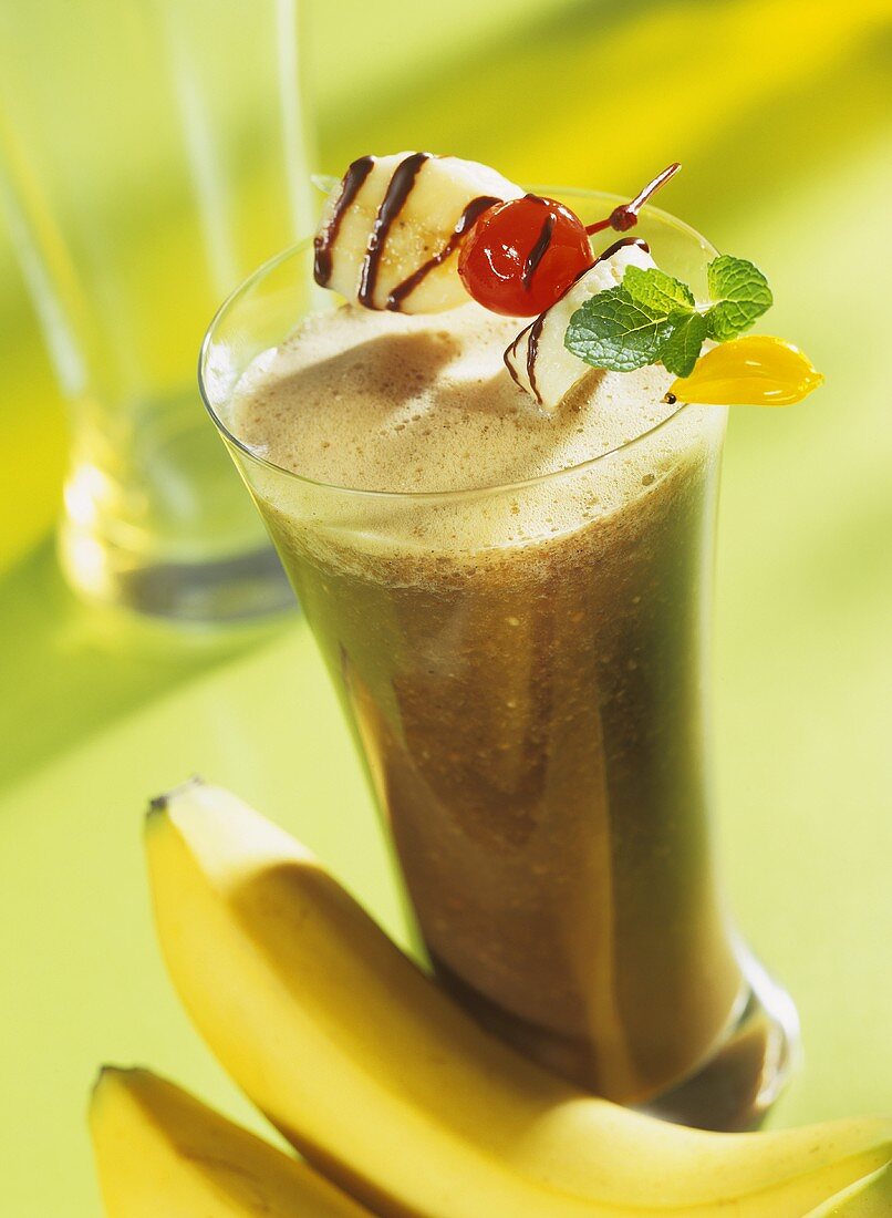 Coffee smoothie with bananas and fruit kebab