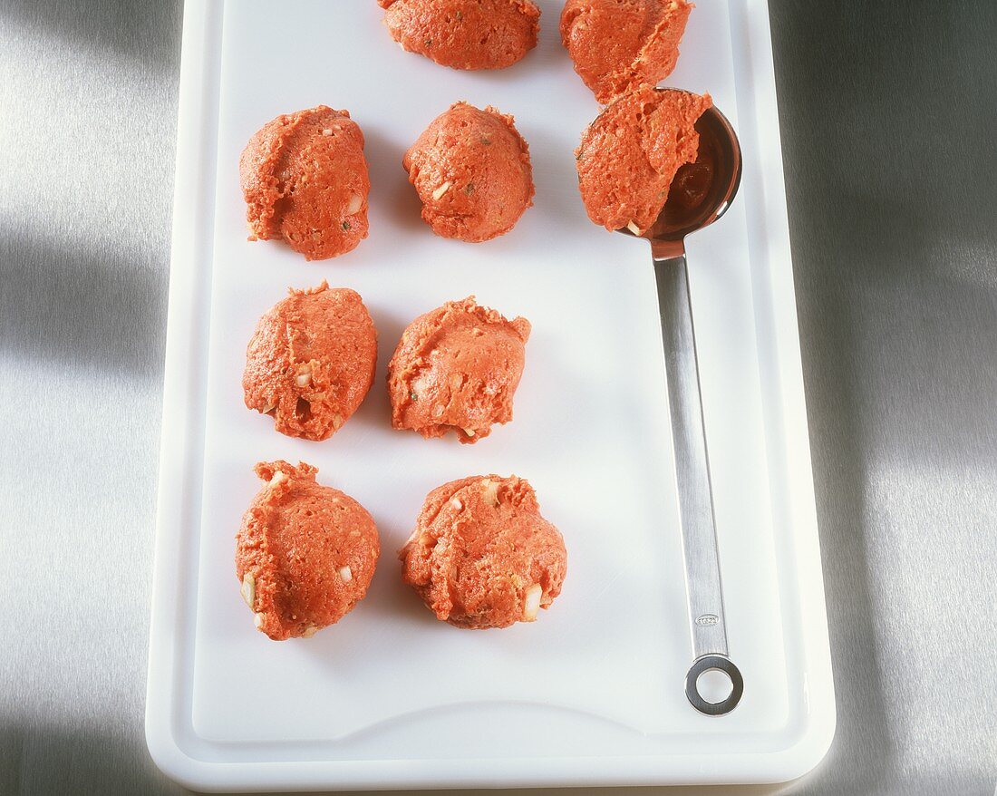 Making rissoles: forming the rissoles in a ladle