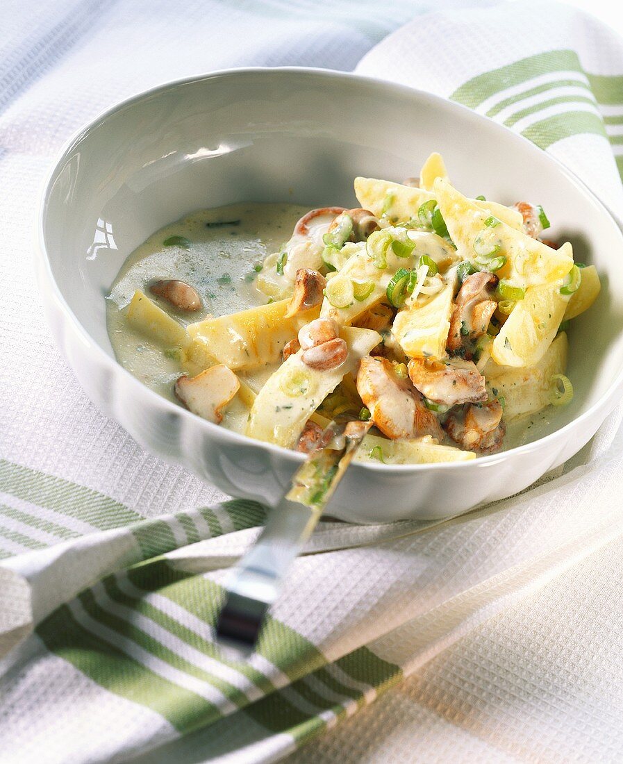 Potato and mushroom ragout with spring onions
