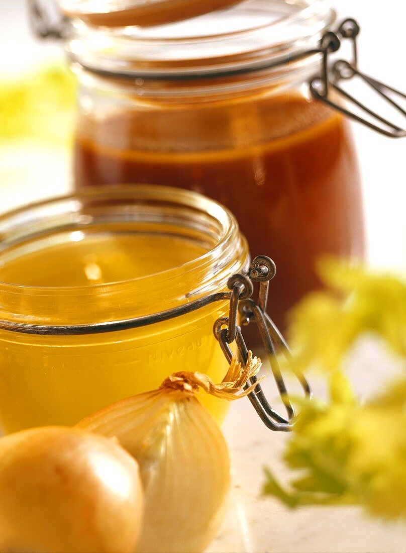 Brown stock and chicken stock in jars